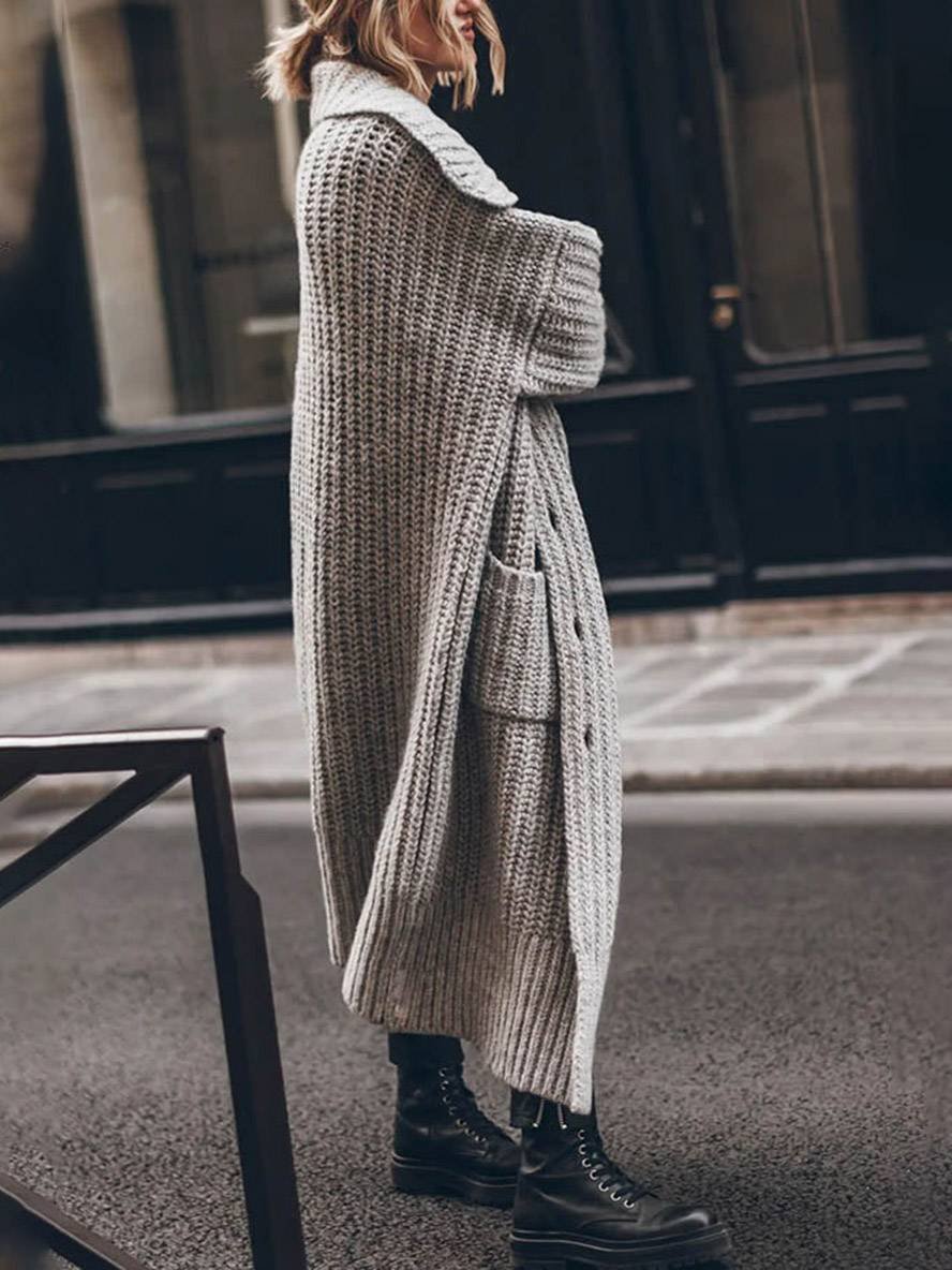 Women's longline chunky knit cardigan with a wide collar and patch pockets