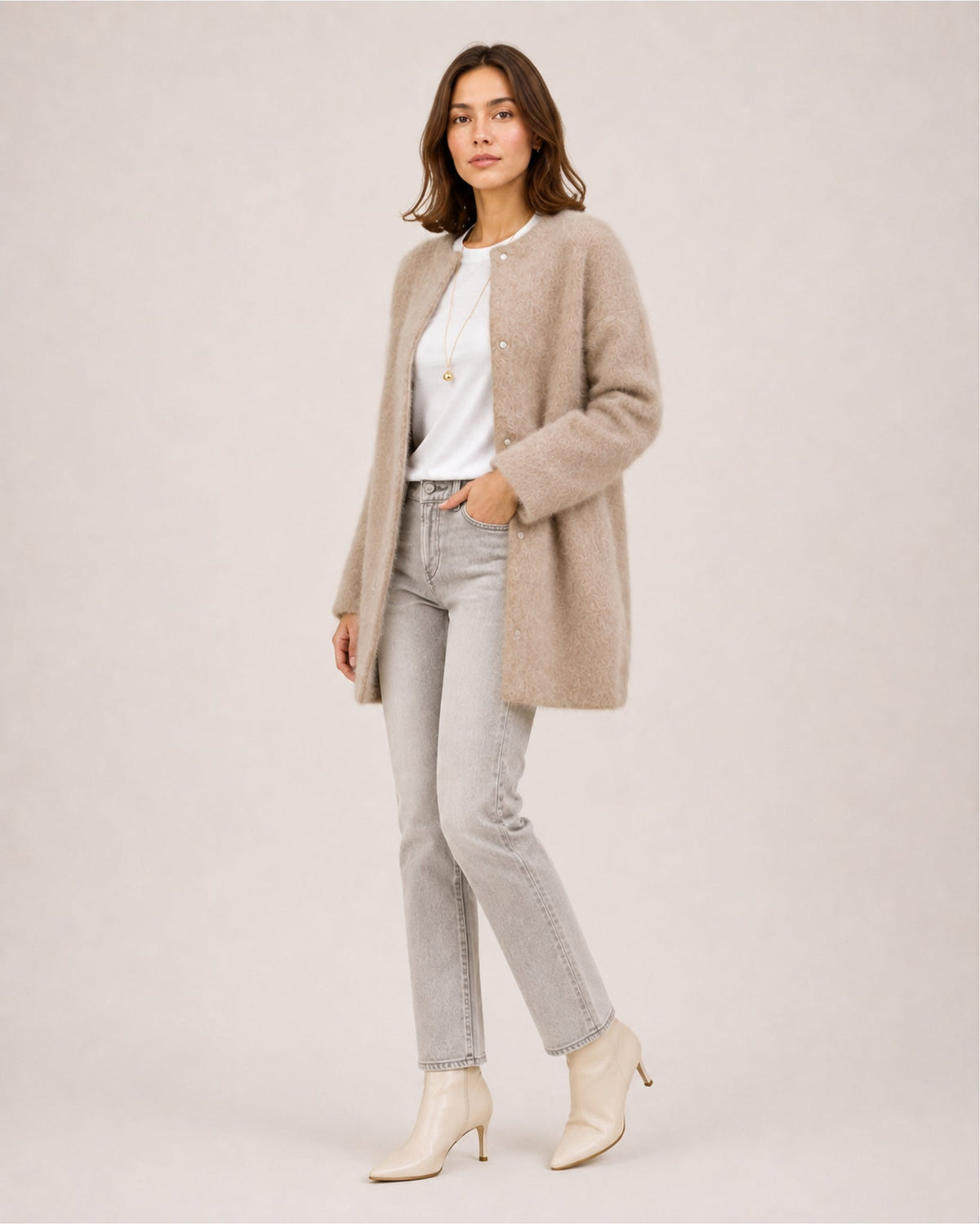 Women's longline fluffy cardigan with a round neck and side pockets