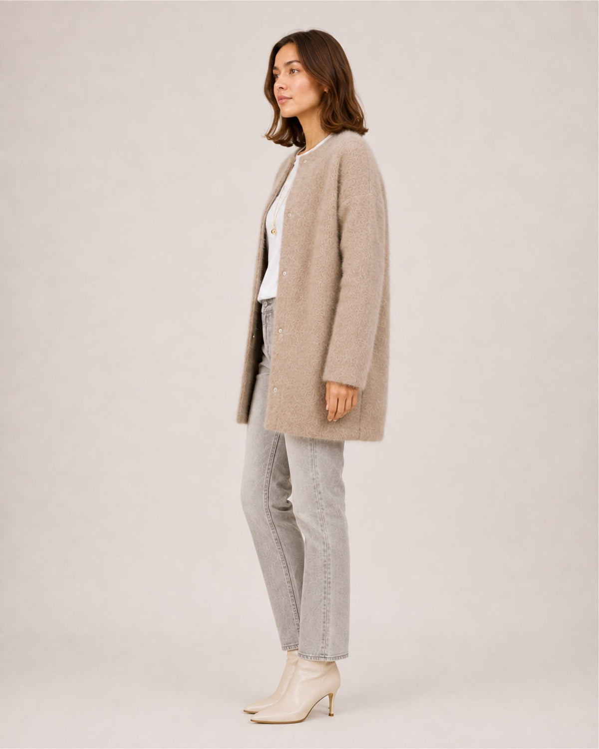 Women's longline fluffy cardigan with a round neck and side pockets