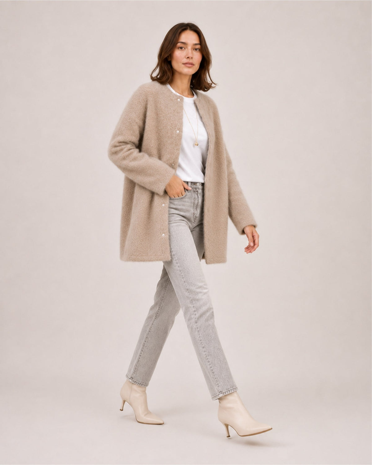 Women's longline fluffy cardigan with a round neck and side pockets