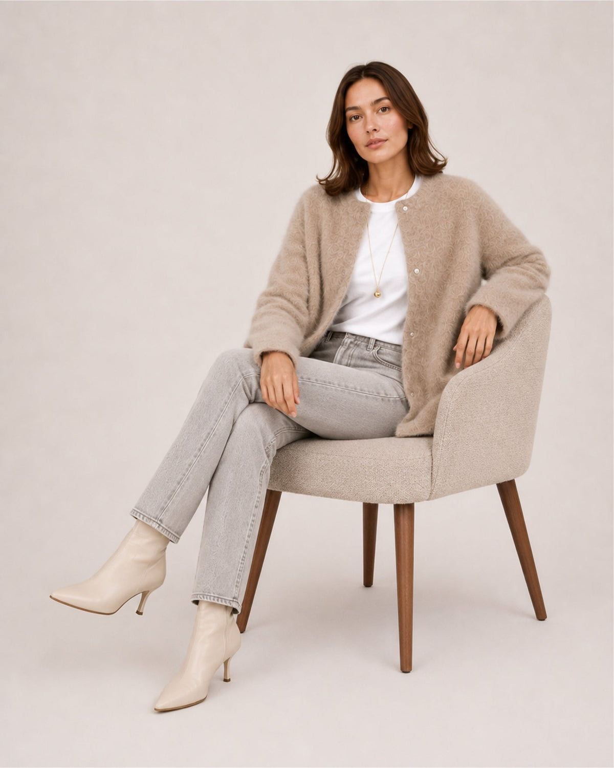 Women's longline fluffy cardigan with a round neck and side pockets