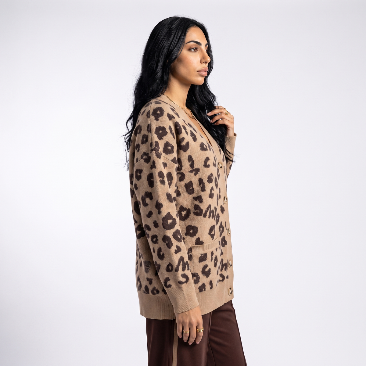 Women's longline leopard knit cardigan with a V-neck and patch pockets