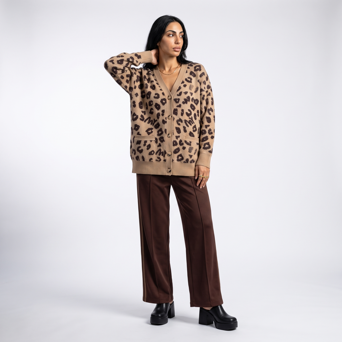 Women's longline leopard knit cardigan with a V-neck and patch pockets