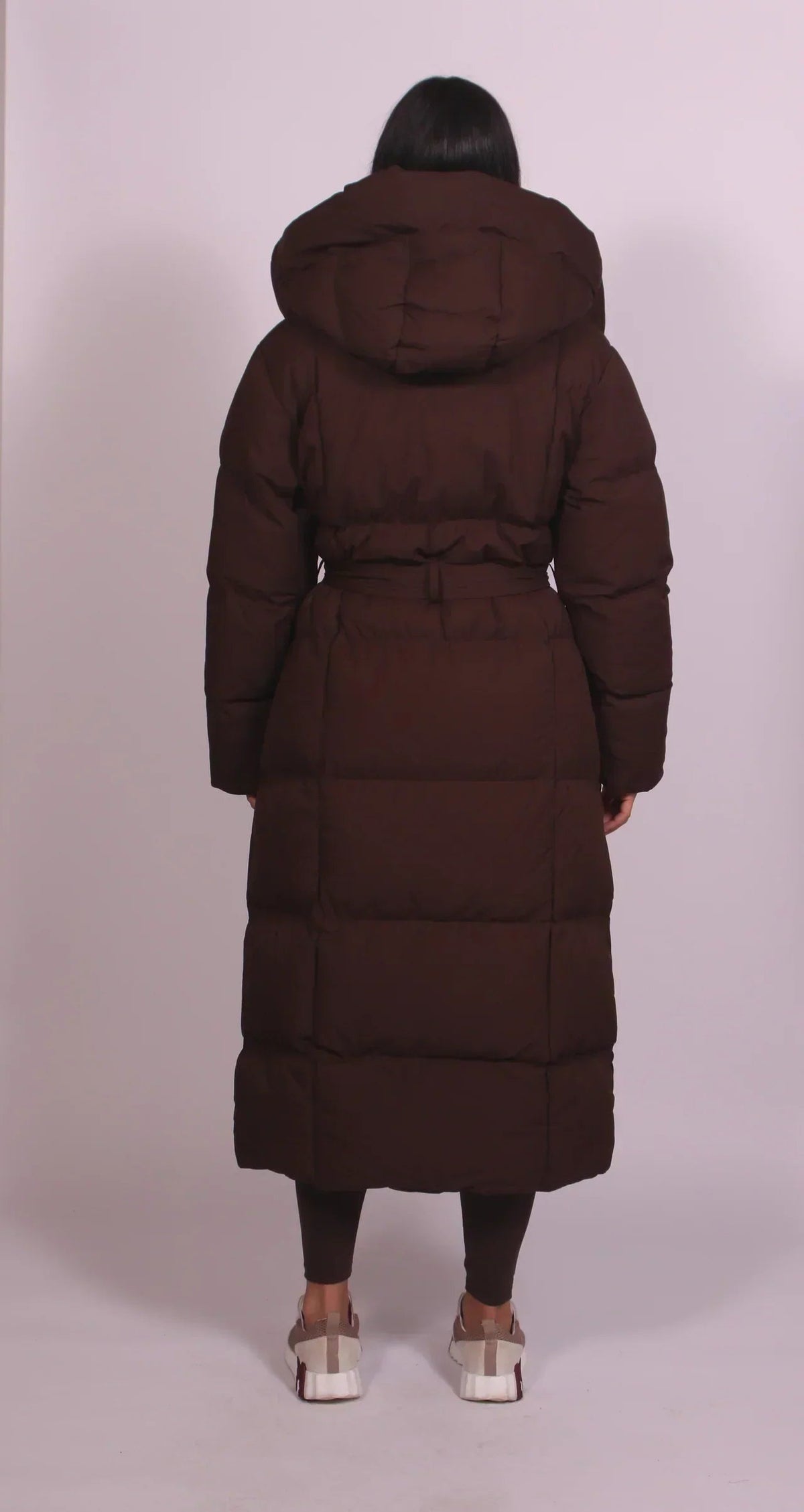 Women's longline puffer coat with a hood and tie belt - chocolate brown