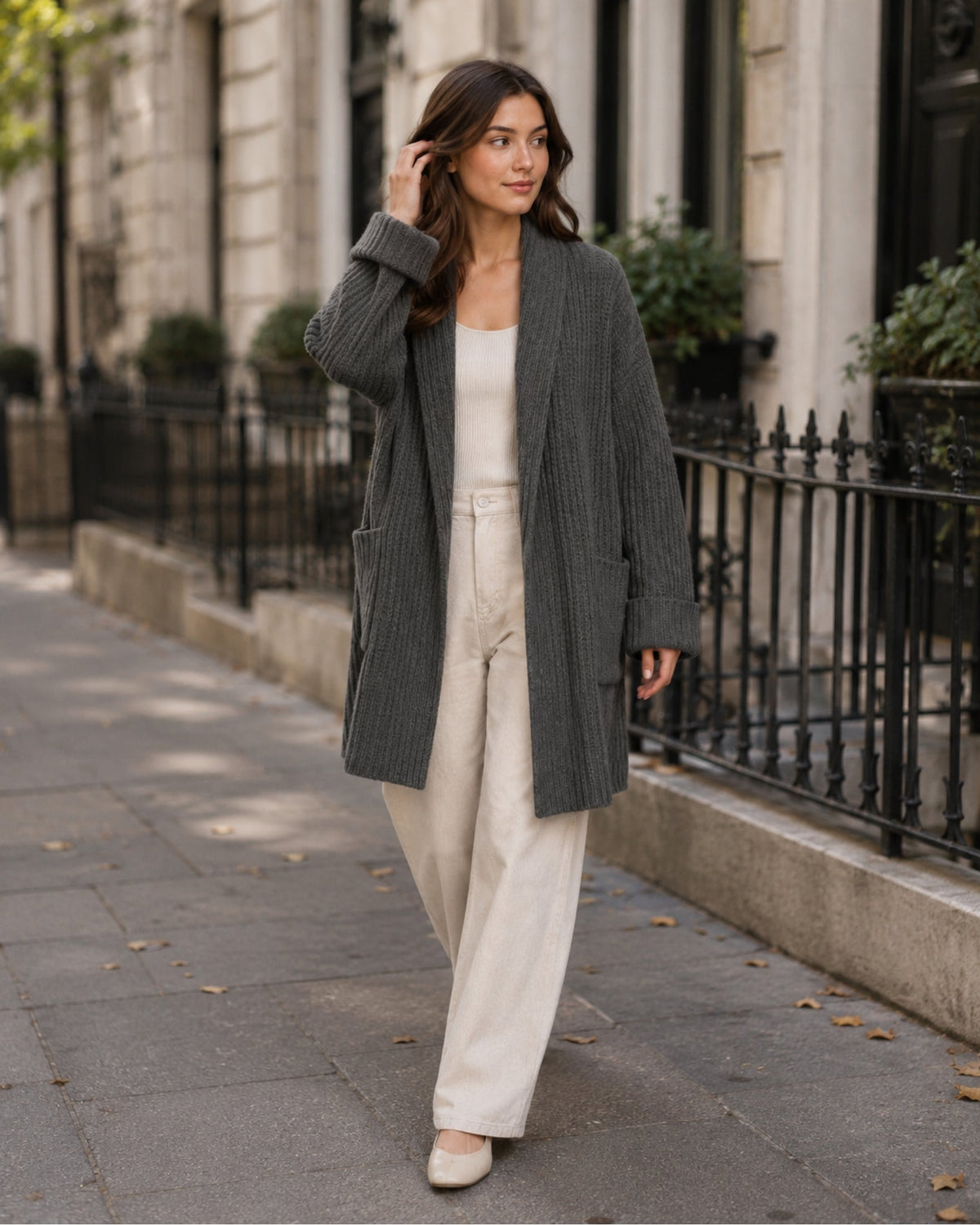 Women's longline ribbed cardigan with a shawl collar and patch pockets