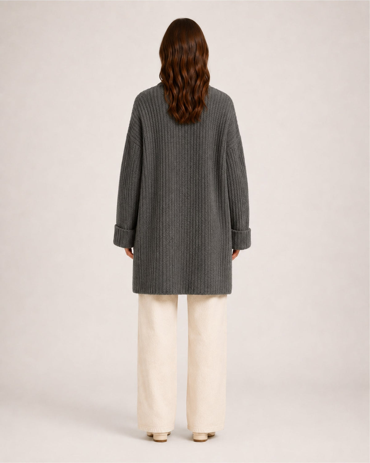 Women's longline ribbed cardigan with a shawl collar and patch pockets
