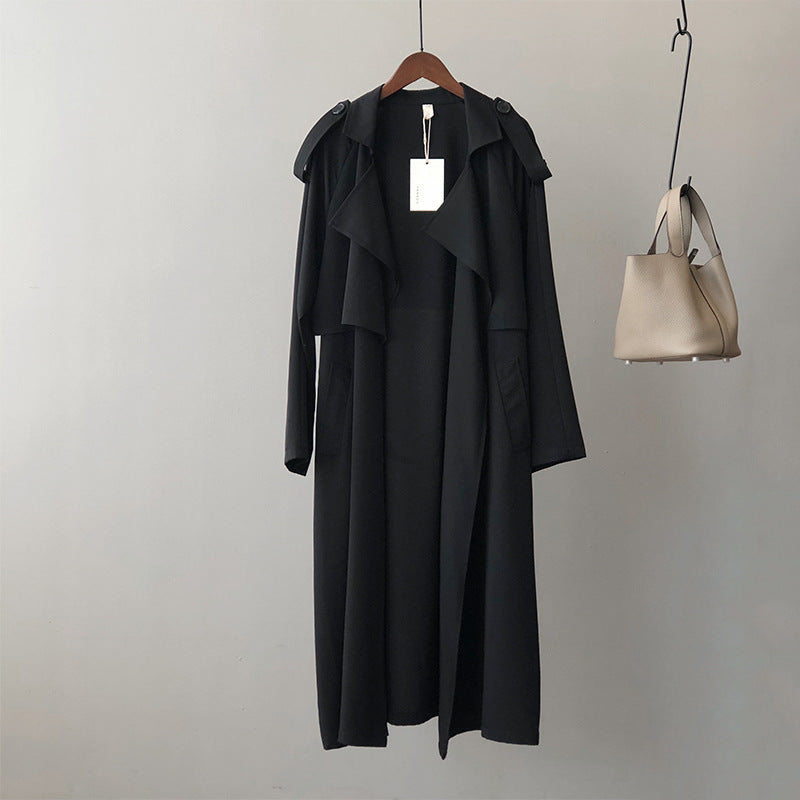 Women's longline trench coat with wide draped lapels and a tie belt - black