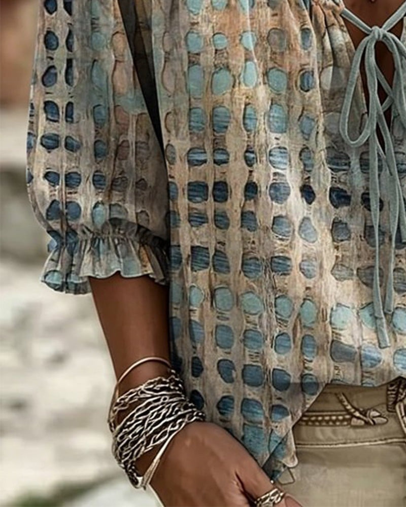 Loose polka dot blouse with a ruffled V-neck and tie cord - view 3