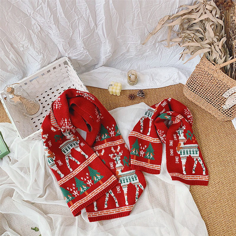 Red knitted Christmas scarf with a reindeer and trees, for parent and child