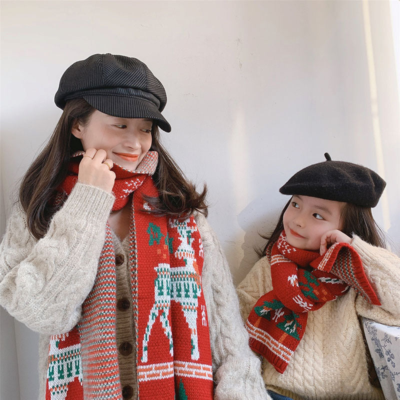 Red knitted Christmas scarf with a reindeer and trees, for parent and child