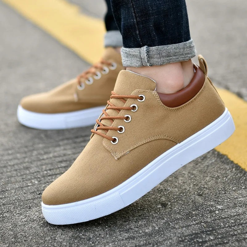 Men's canvas trainers with a white rubber sole, tan laces and a faux leather heel piece - camel