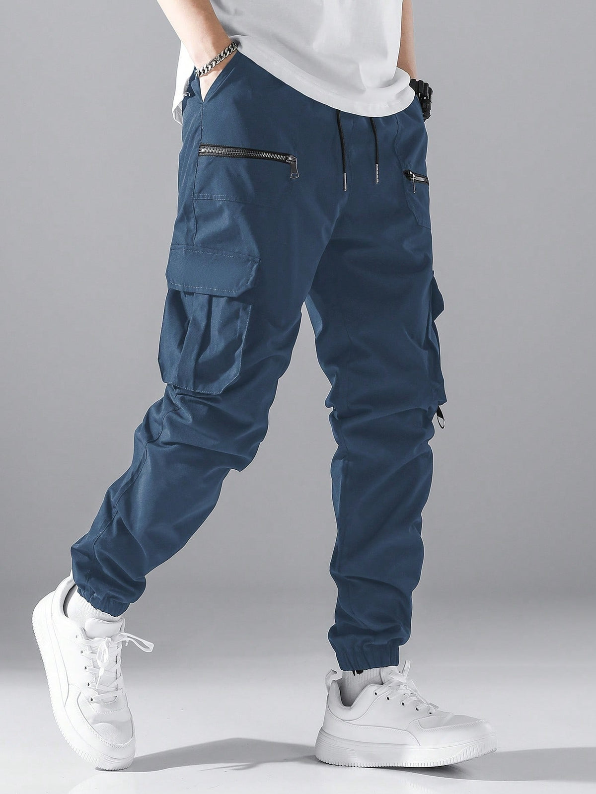 Cargo joggers for men with a drawcord waist, zip pockets, thigh flap pockets and cuffed ankles - petrol blue