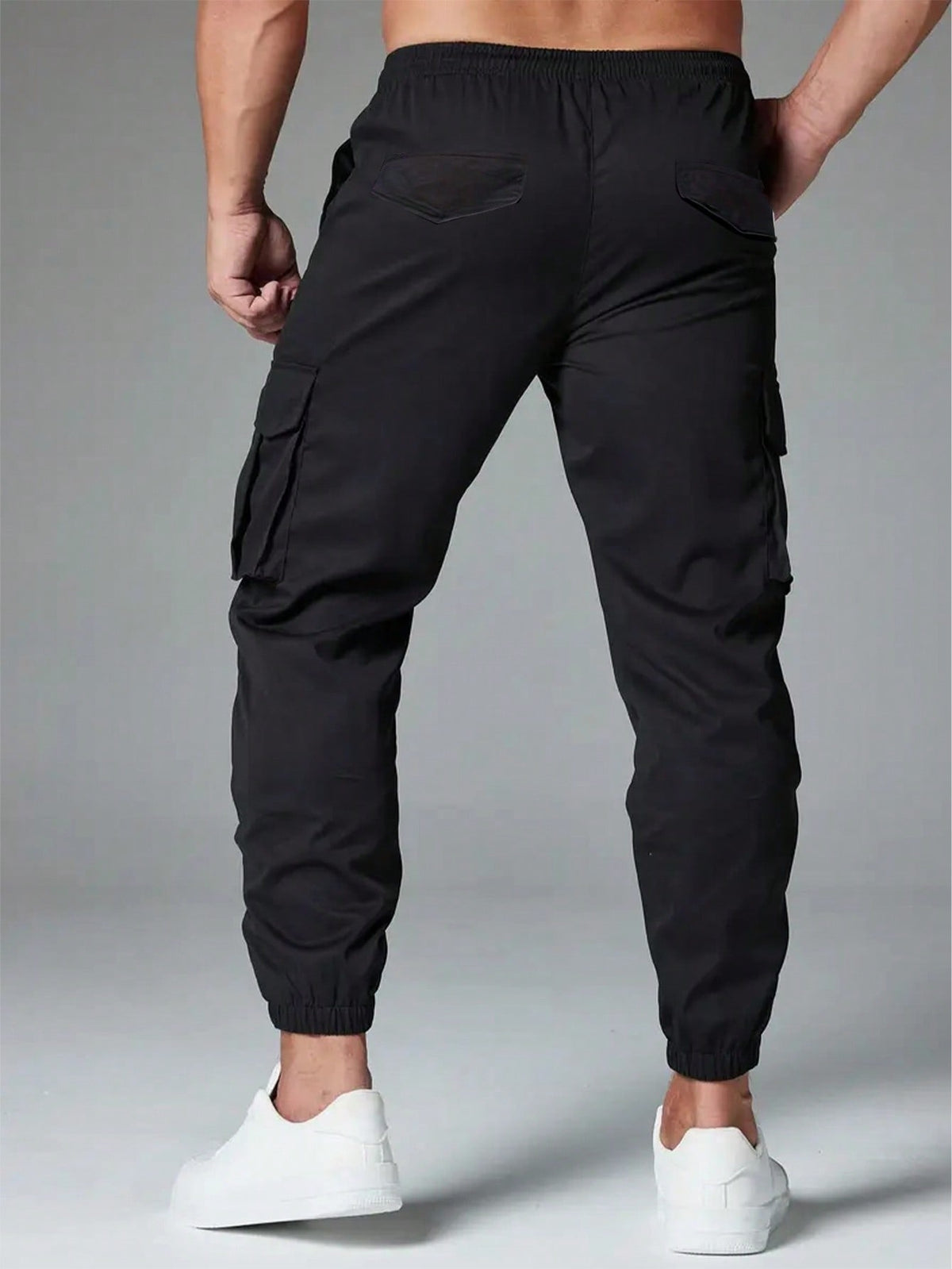 Cargo trousers for men with a drawcord waist, thigh flap pockets and elastic cuffs at the ankle - view 5
