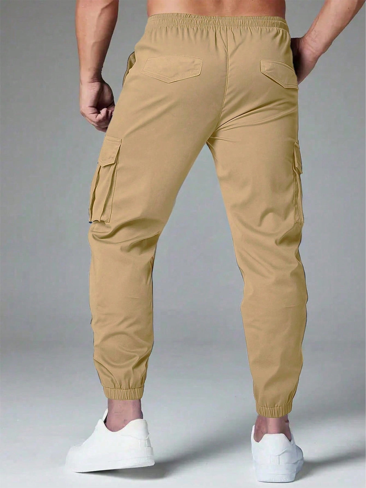 Cargo trousers for men with a drawcord waist, thigh flap pockets and elastic cuffs at the ankle - view 6