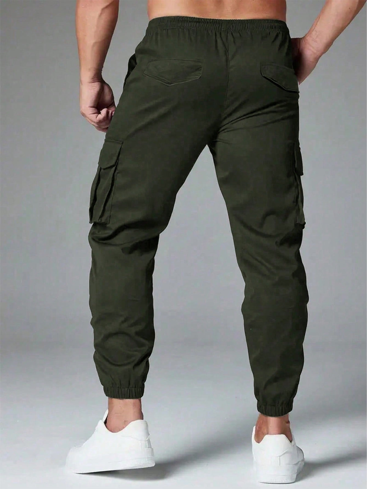 Cargo trousers for men with a drawcord waist, thigh flap pockets and elastic cuffs at the ankle - view 7