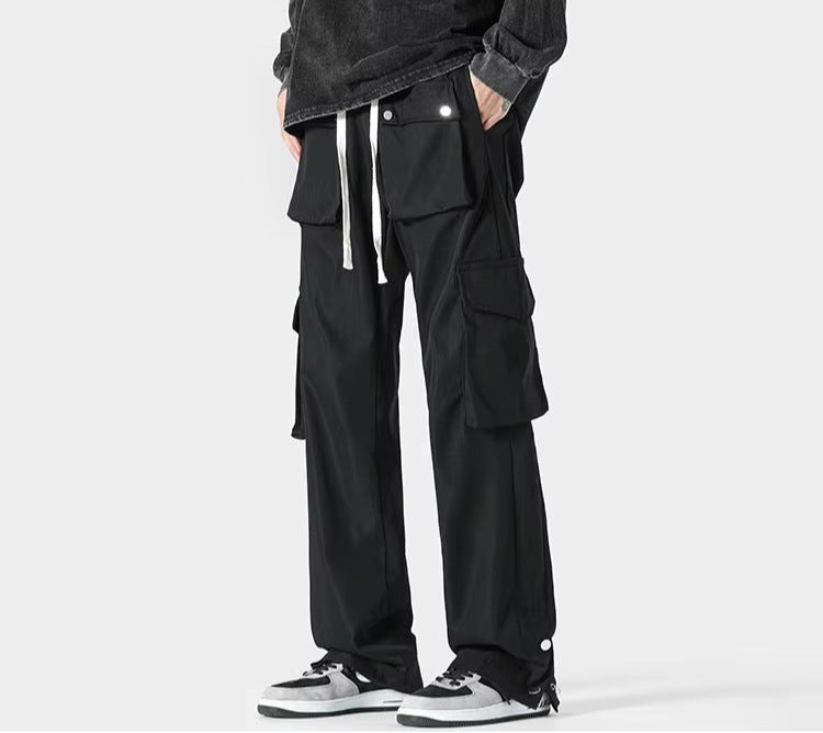 Men's cargo trousers with flap pockets at the waist and thighs, a drawcord and popper hems - black