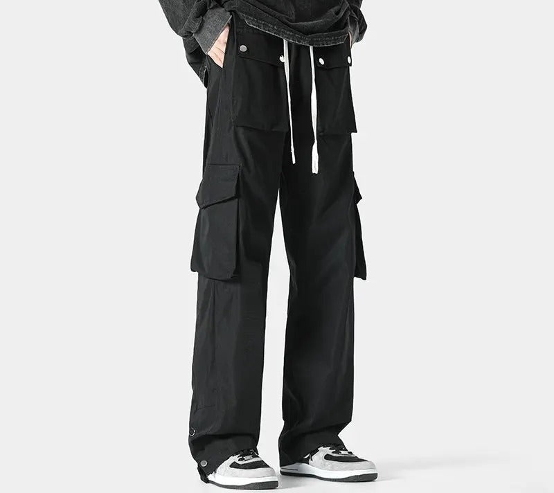 Men's cargo trousers with flap pockets at the waist and thighs, a drawcord and popper hems - view 2