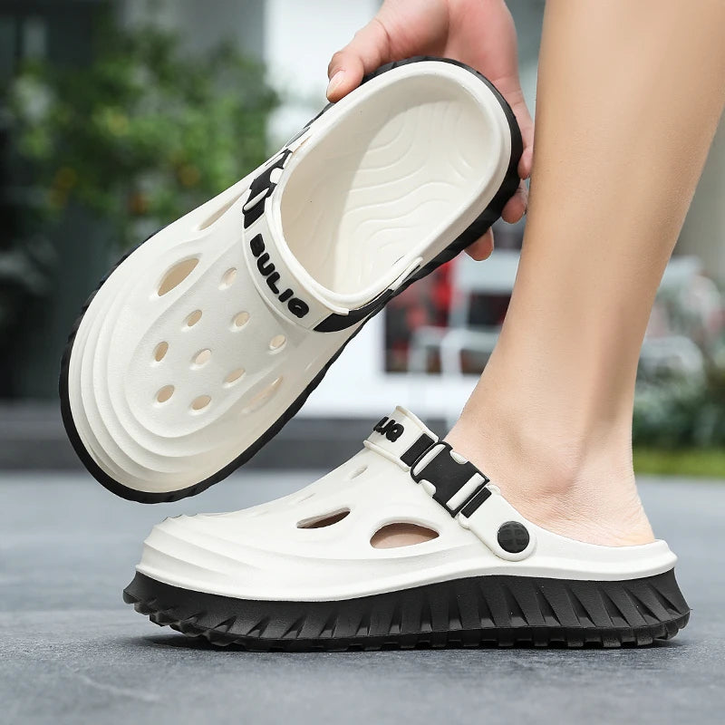 EVA clogs with a high sole, closed toe, vent holes and buckle heel strap
