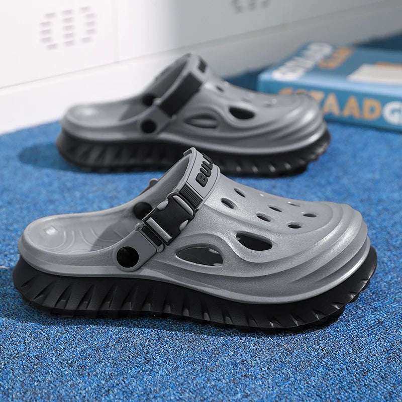 EVA clogs with a high sole, closed toe, vent holes and buckle heel strap - grey