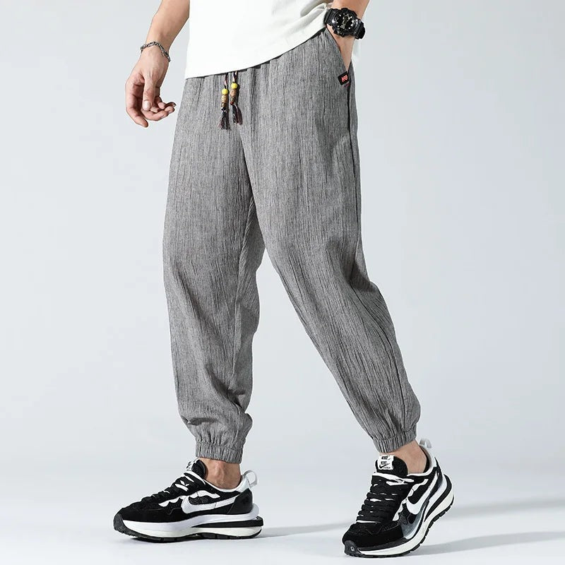 Men's lightweight cotton linen trousers with elasticated cuffs and a beaded drawcord - grey