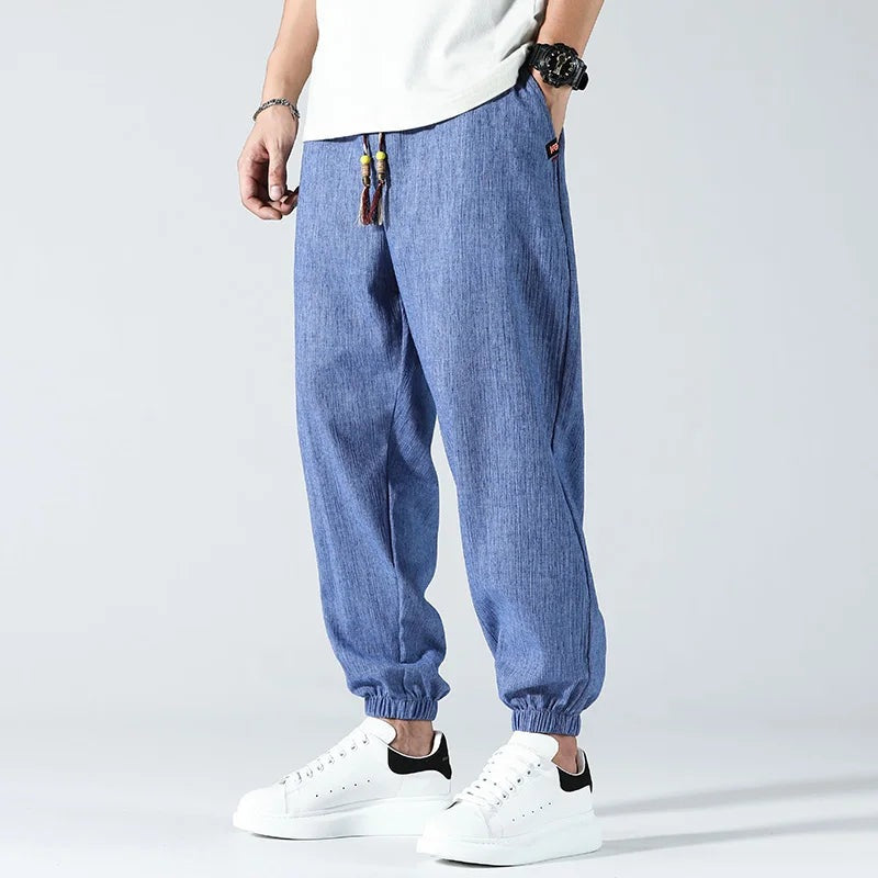 Men's lightweight cotton linen trousers with elasticated cuffs and a beaded drawcord - blue