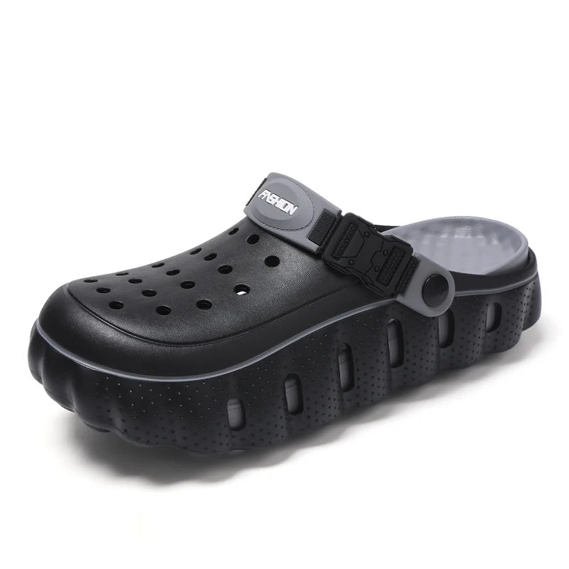 EVA clogs with a closed toe, thick scalloped sole and buckle heel strap - black