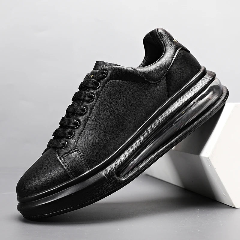 Men's faux leather trainers with a thick sole, visible air cushion and suede-look heel piece - black