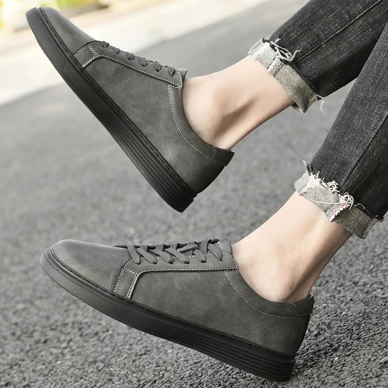 Men's matte faux leather trainers with white contrast stitching and a ribbed cupsole - view 4