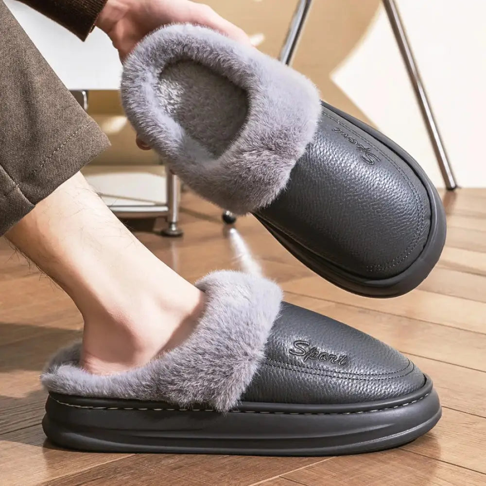 Mule slippers with a smooth faux leather upper, plush lining and cuff and a thick sole