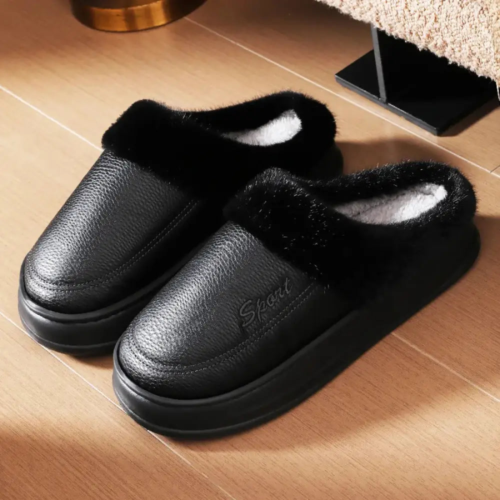 Mule slippers with a smooth faux leather upper, plush lining and cuff and a thick sole - black