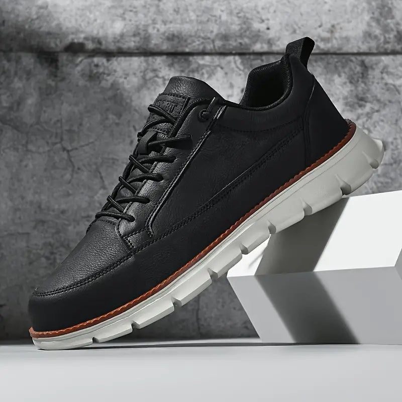 Men's smooth faux leather trainers with a flexible grooved sole and tan welt - black