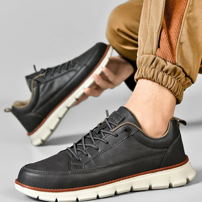 Men's smooth faux leather trainers with a flexible grooved sole and tan welt - view 8