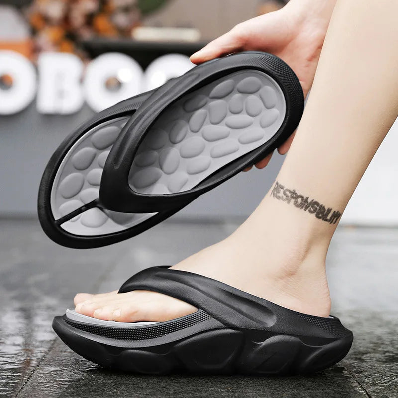 Men's EVA flip flops with thick sole, pebble-shaped nubbed footbed and wide strap