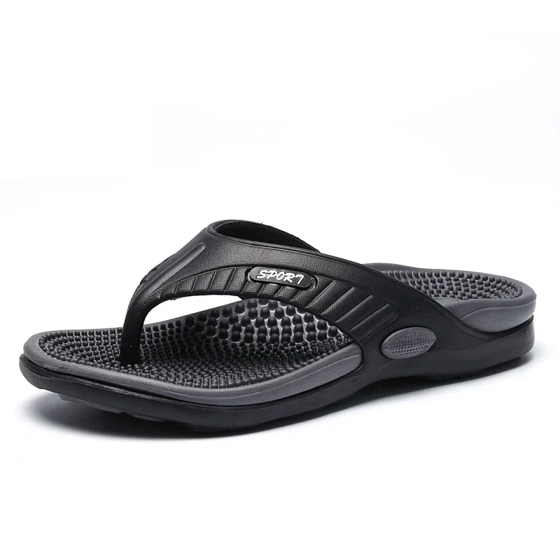 Flip flops with a studded footbed, wide toe strap and sole with tread - black