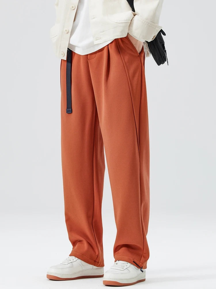 Men's heavyweight joggers with a built-in belt, front pleats and elasticated cuffs at the ankle - rust orange