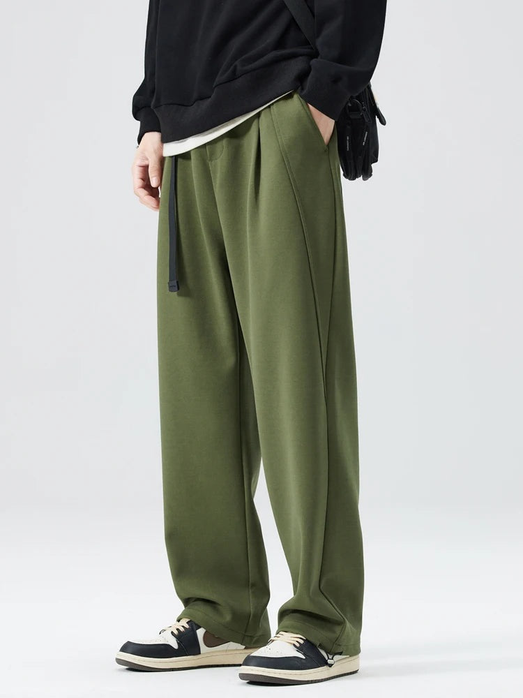 Men's heavyweight joggers with a built-in belt, front pleats and elasticated cuffs at the ankle - olive green