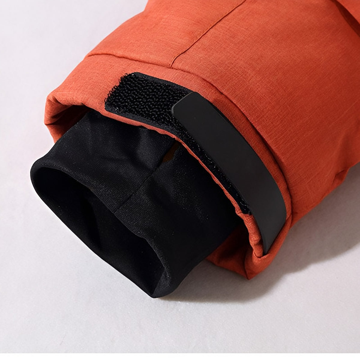Men's hooded puffer jacket with wide quilted panels, zipped chest pockets and adjustable cuffs
