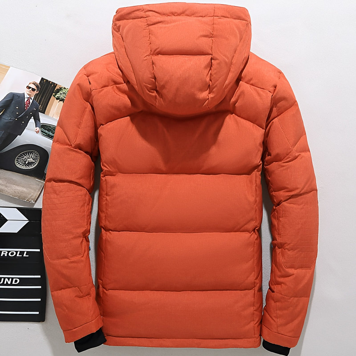Men's hooded puffer jacket with wide quilted panels, zipped chest pockets and adjustable cuffs