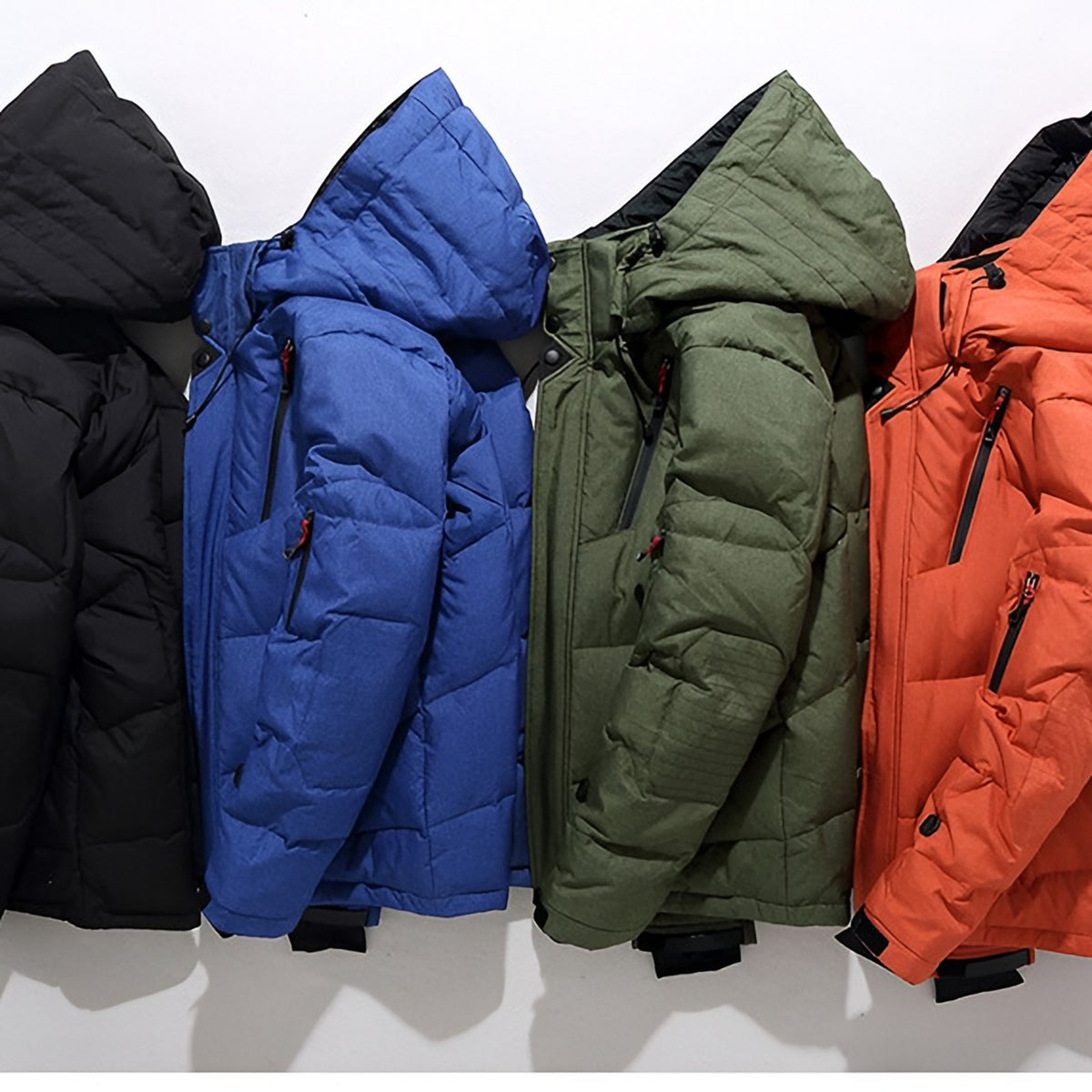Men's hooded puffer jacket with wide quilted panels, zipped chest pockets and adjustable cuffs