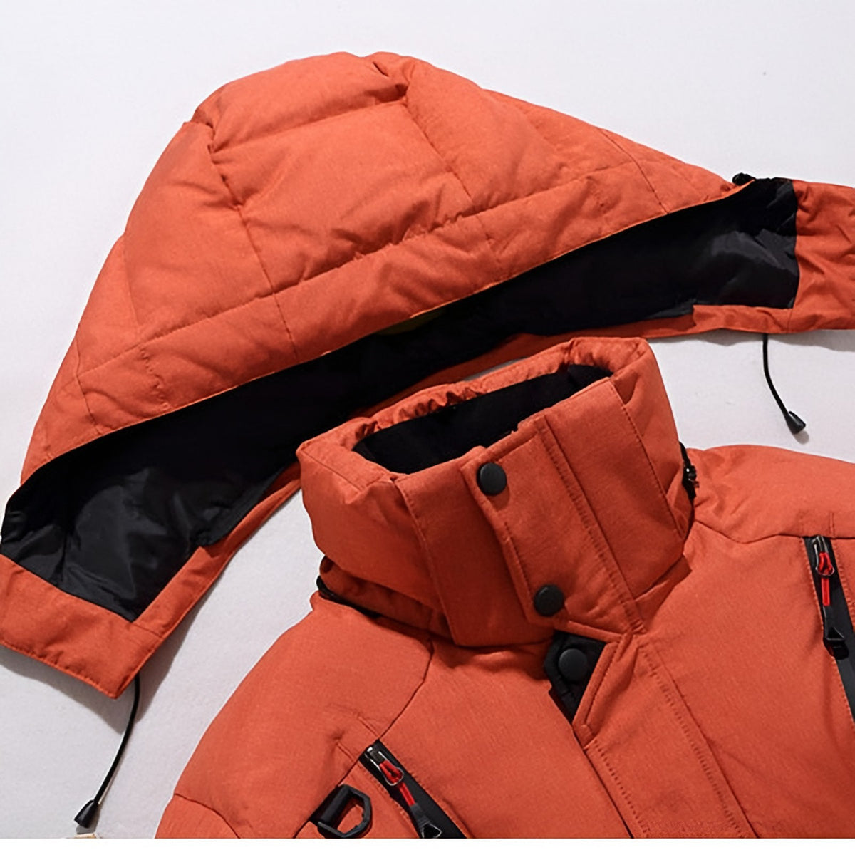 Men's hooded puffer jacket with wide quilted panels, zipped chest pockets and adjustable cuffs