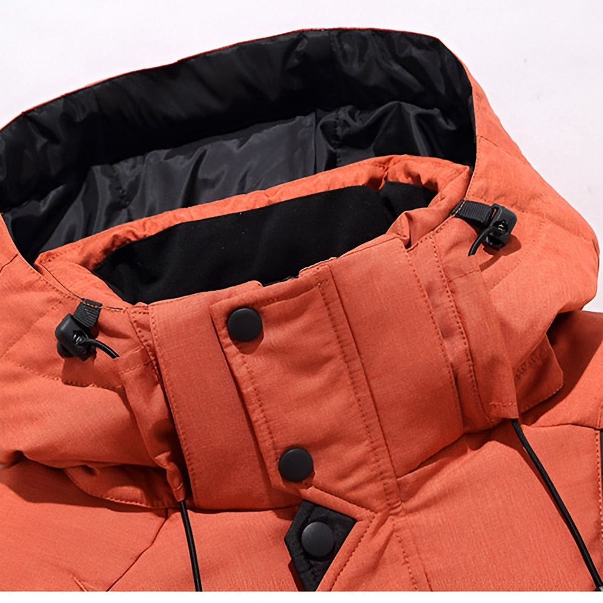 Men's hooded puffer jacket with wide quilted panels, zipped chest pockets and adjustable cuffs