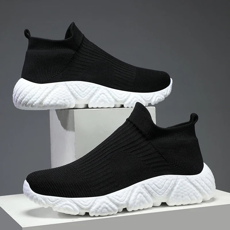 Men's knit slip-on trainers with a sock collar and a chunky textured foam sole - black