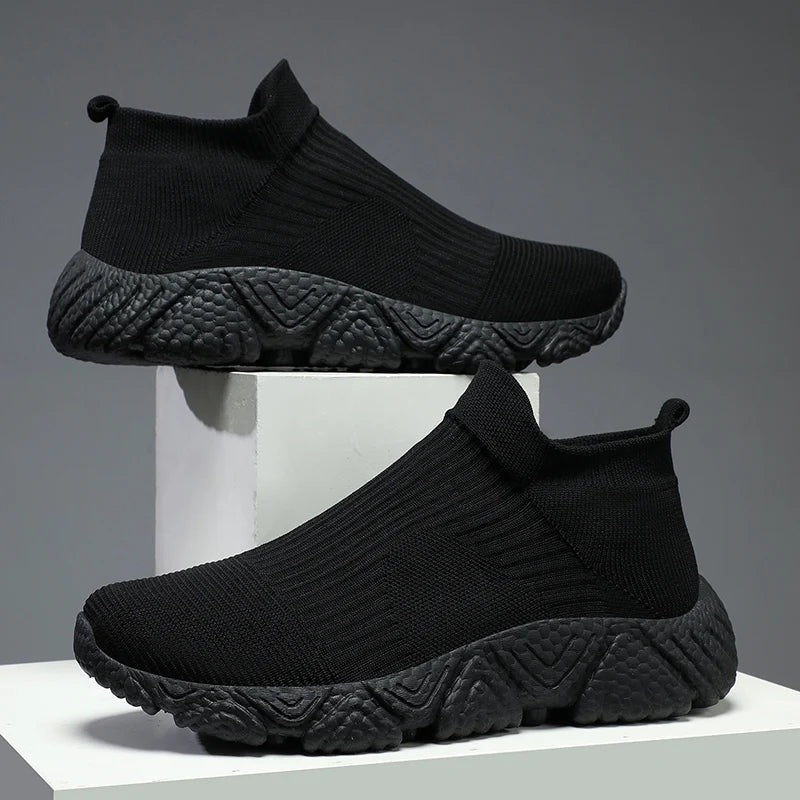 Men's knit slip-on trainers with a sock collar and a chunky textured foam sole - all black