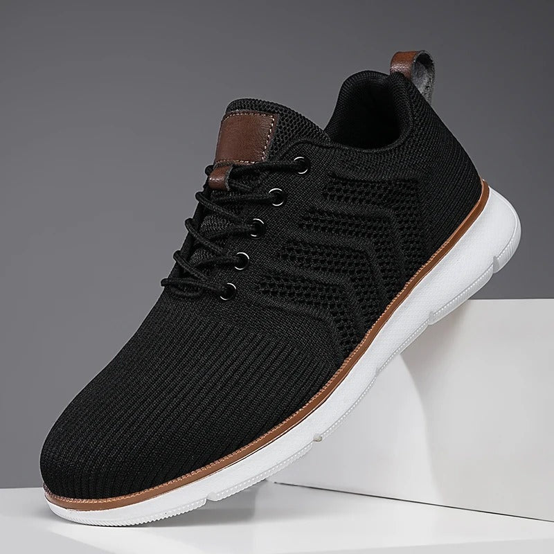 Men's knit trainers with an open chevron pattern, lightweight sole and faux leather tab - black and white