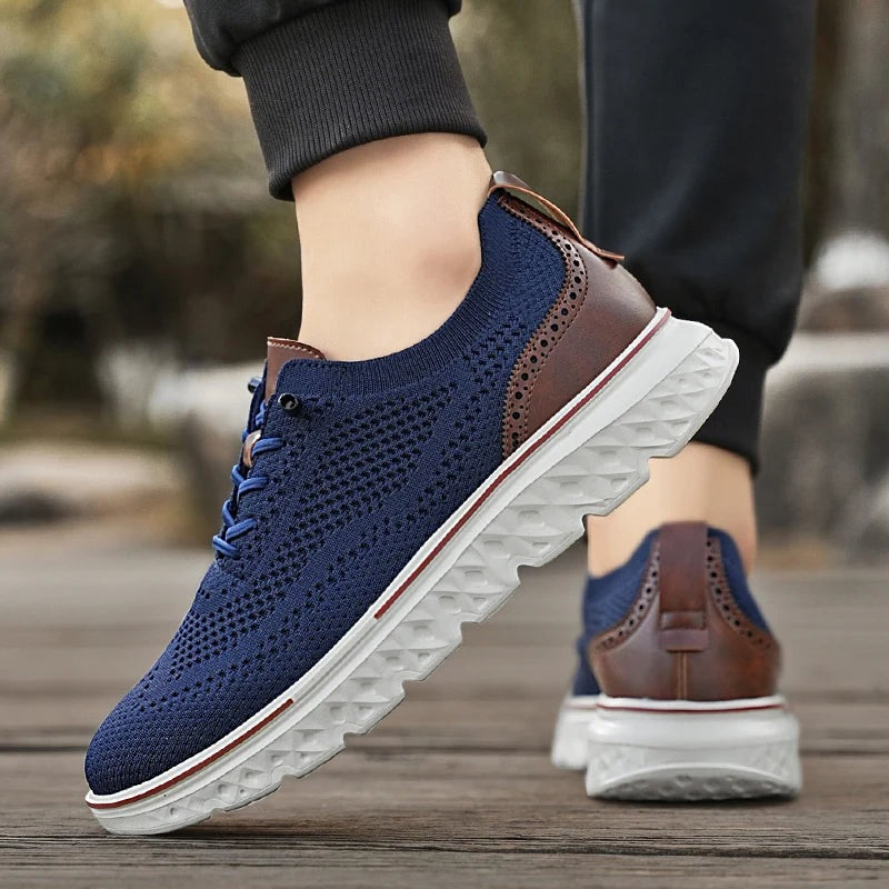 Men's knit mesh trainers with a faux leather heel, red trim along the sole and elastic laces - view 2