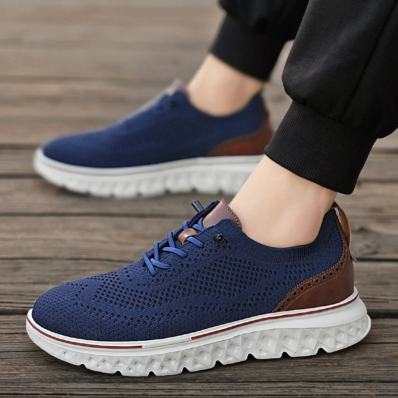 Men's knit mesh trainers with a faux leather heel, red trim along the sole and elastic laces - view 3