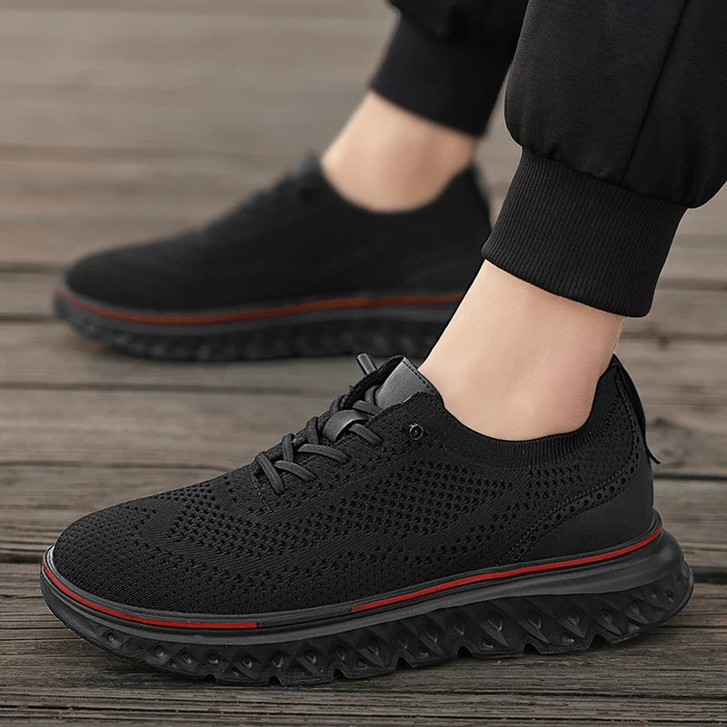 Men's knit mesh trainers with a faux leather heel, red trim along the sole and elastic laces - view 8