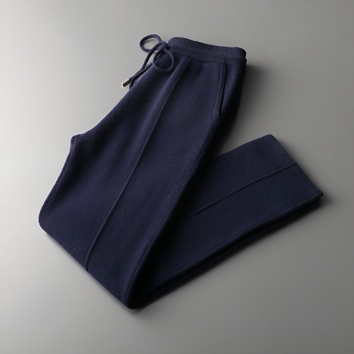 Men's knitted wool trousers in blue, folded with drawstring waist