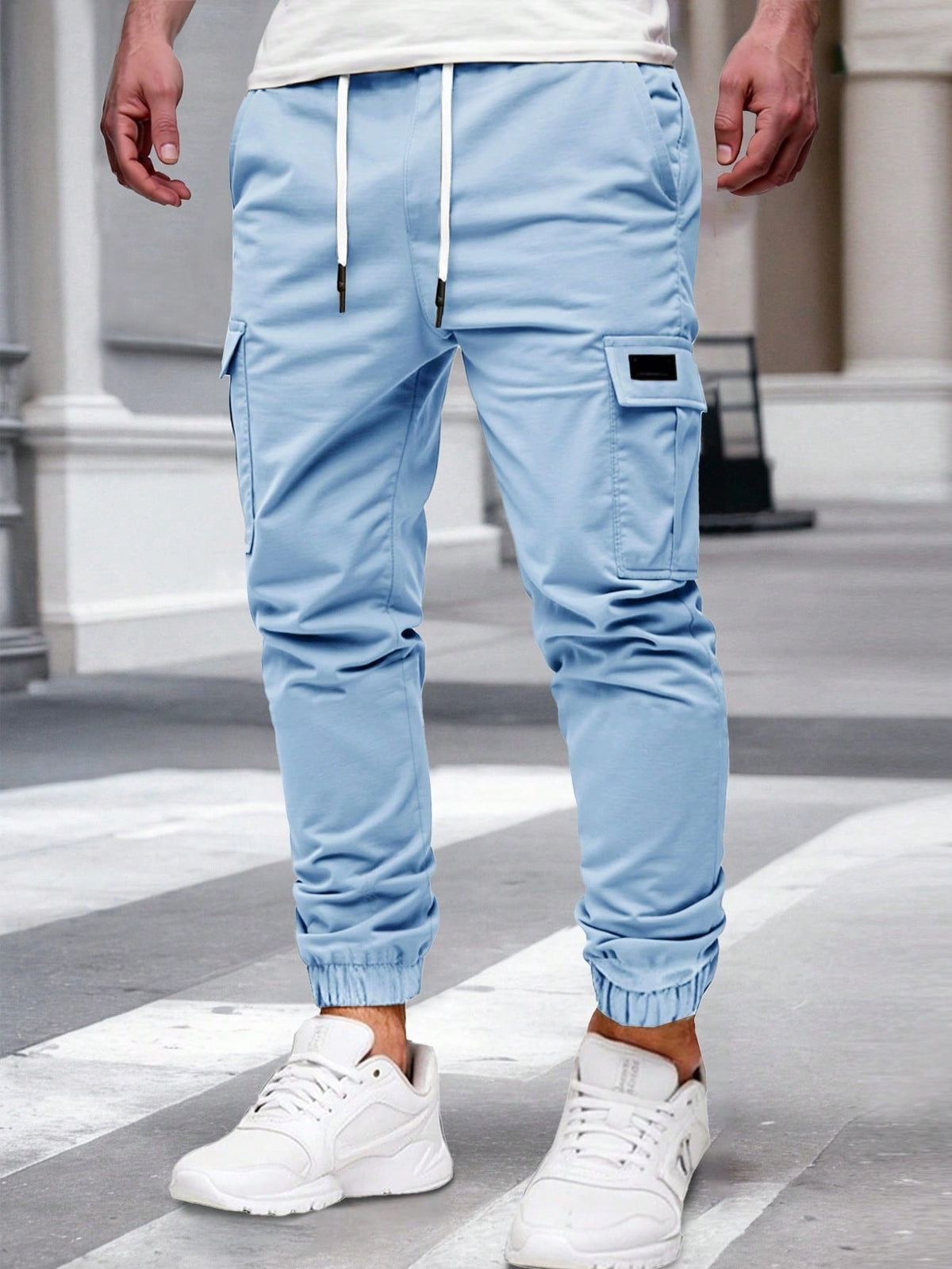 Relaxed cargo joggers for men with a drawcord waist, thigh flap pockets and cuffed ankles - light blue
