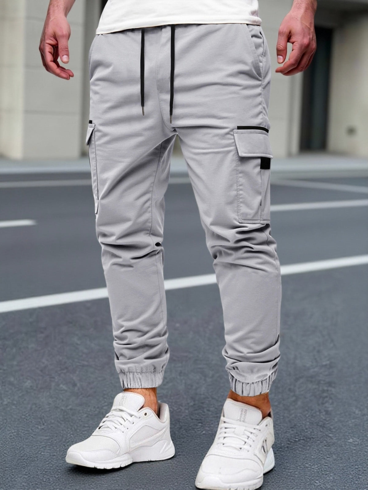 Relaxed cargo joggers for men with a drawcord waist, thigh flap pockets and cuffed ankles - light grey
